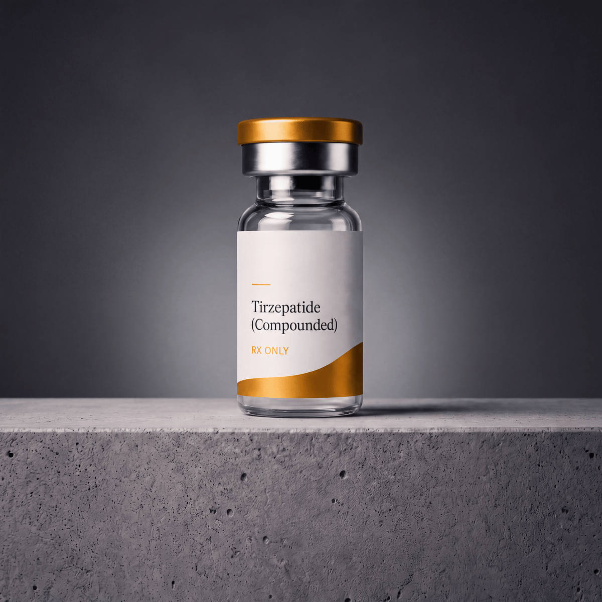 A clear glass vial with a white and gold label reading 'Tirzepatide (Compounded) RX ONLY', set on a gray concrete surface against a dark gray gradient background.